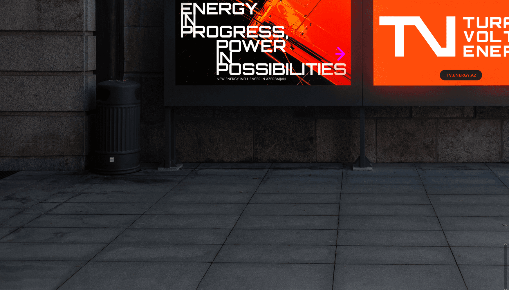 Уличные щиты Turan Volts Energy: плакат «Energy in progress» и оранжевая панель с логотипом